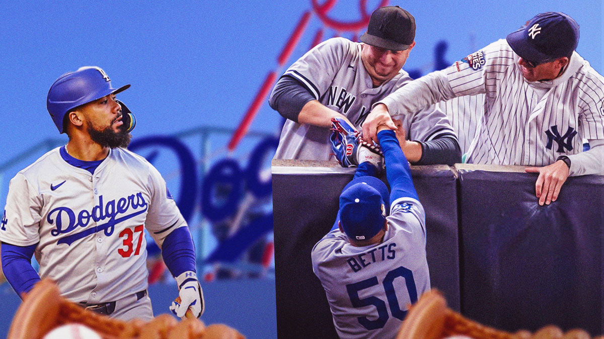 Dodgers' Teoscar Hernandez next to Mookie Betts and the fan that grabbed his glove.