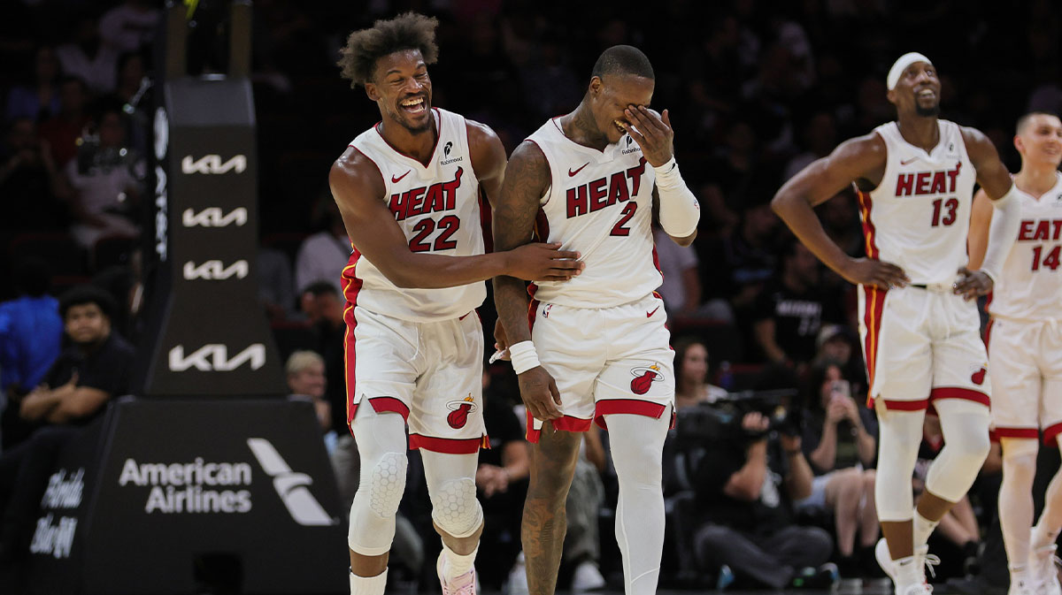 Miami Heat forward Jimmy Butler (22) and guard Terry Rozier (2) reacts against the San Antonio Spurs during the third quarter at Kaseya Center.