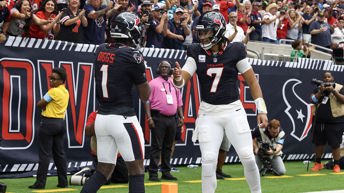 Houston Texans quarterback C.J. Stroud (7) celebrates with wide receiver Stefon Diggs (1) following a first quarter touchdown against the Jacksonville Jaguars at NRG Stadium