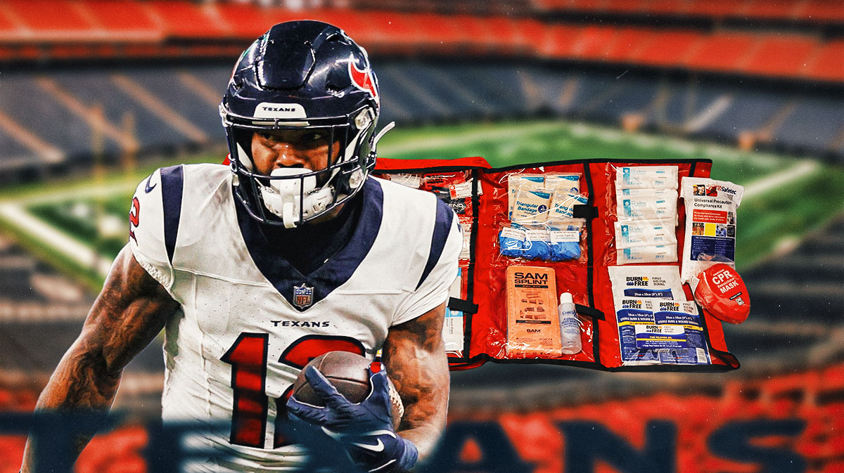 Nico Collins with a first aid kit near him.