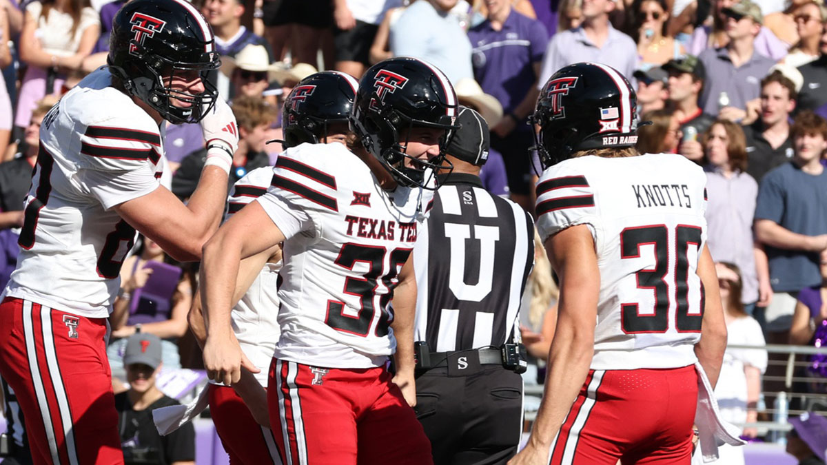 Texas Tech Red Raiders place kicker Reese Burkhardt (38) celebrates after running a trick play for a touchdown against the TCU Horned Frogs in the second quarter at Amon G. Carter Stadium.