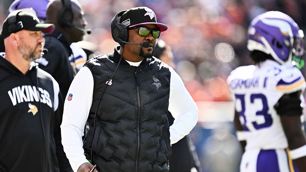 Minnesota Vikings defensive coordinator Brian Flores watches his team play against the Chicago Bears at Soldier Field.