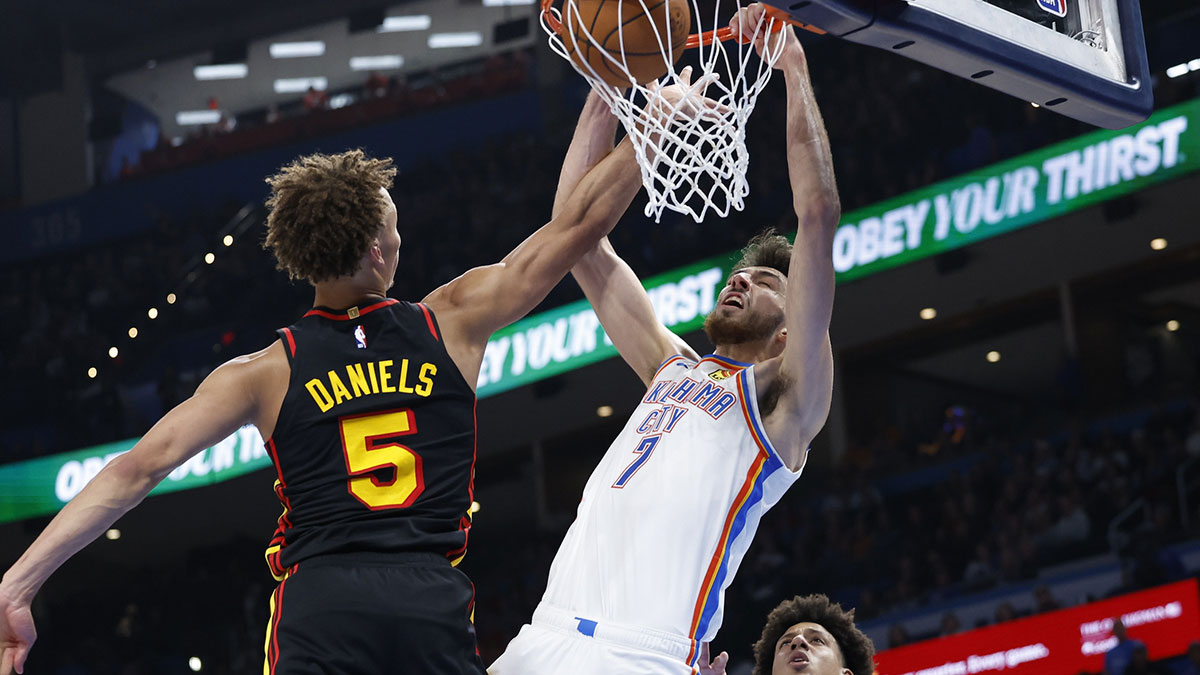 Thunder forward Chet Holmgren (7) dunks in front of Atlanta Hawks guard Dyson Daniels (5) during the second half at Paycom Center