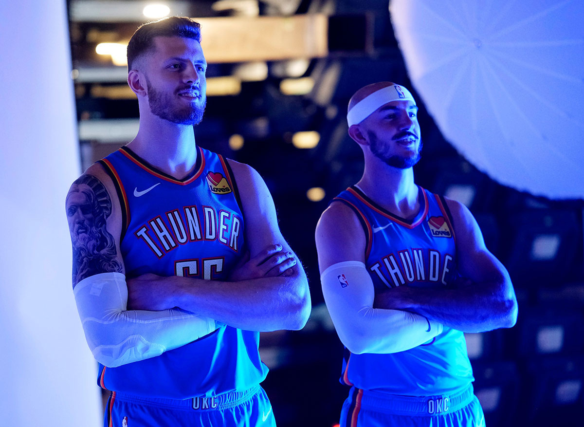 Isaiah Hartenstein and Alex Caruso pose for their photo. Thunder media day ay the Paycom Center Monday, Sept. 30, 2024.