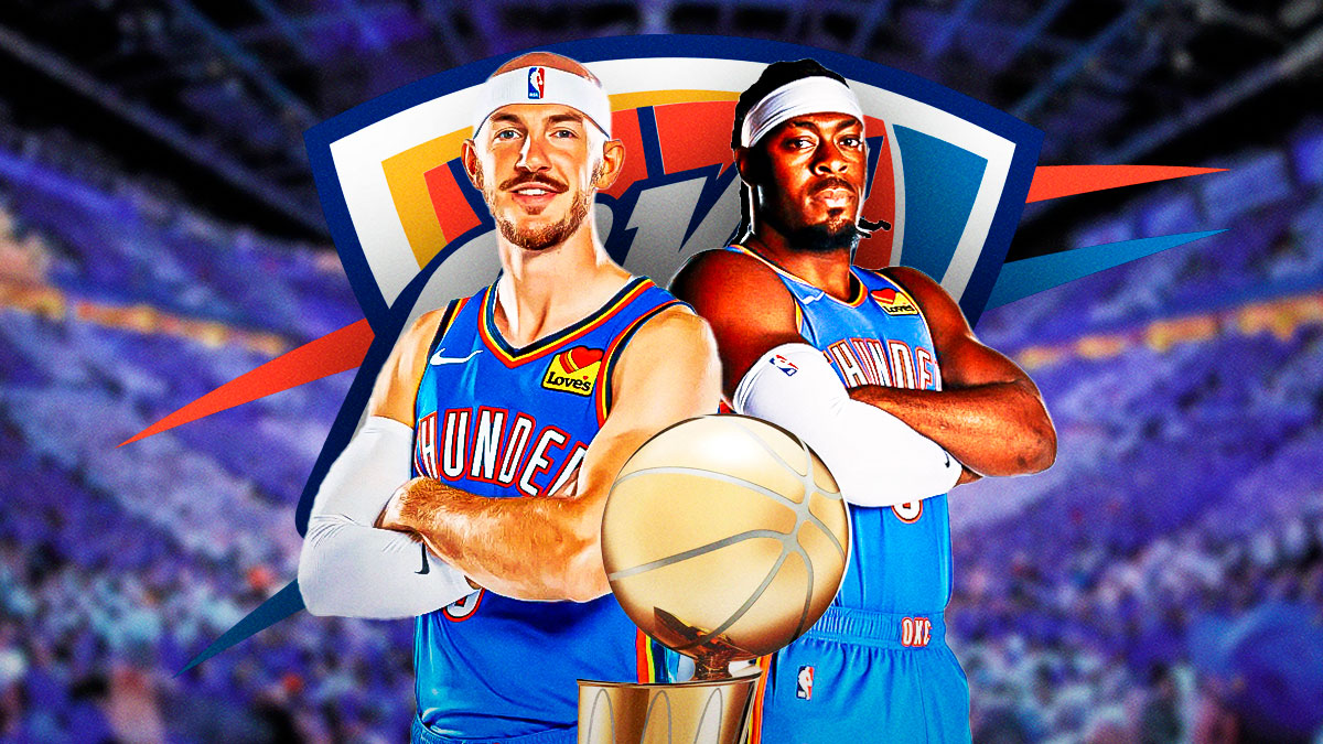 Thunder Lu Dort next to Thunder guard Alex Caruso, the Thunder logo & the Larry O'Brien trophy