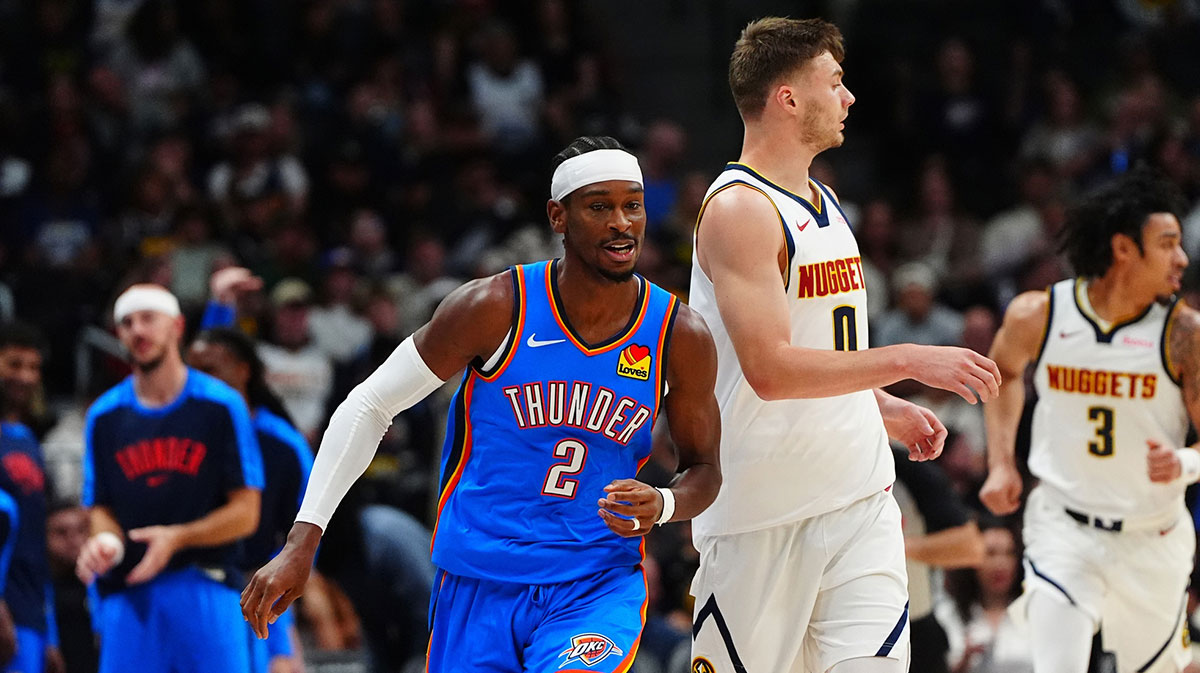 Thunder guard Shai Gilgeous-Alexander (2) and Denver Nuggets guard Christian Braun (0) during the first quarter at Ball Arena