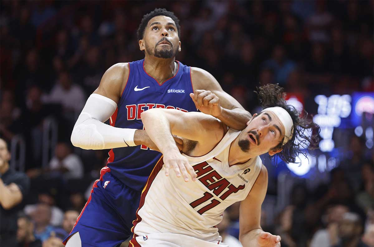 Detroit Pistons forward Tobias Harris (12) and Miami Heat guard Jaime Jaquez Jr. (11) battle for position to get a rebound during the second half at Kaseya Center. 