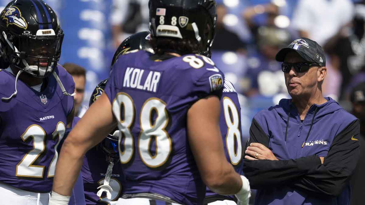 Baltimore Ravens offensive coordinator Todd Monken speaks with members of the offense before the game against the Las Vegas Raiders at M&T Bank Stadium. 