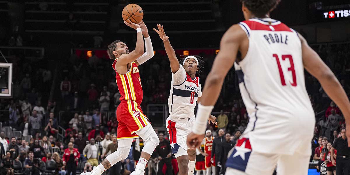 Atlanta Hawks guard Trae Young (11) can’t make a last second shot over Washington Wizards guard Bilal Coulibaly (0) during the second half at State Farm Arena.