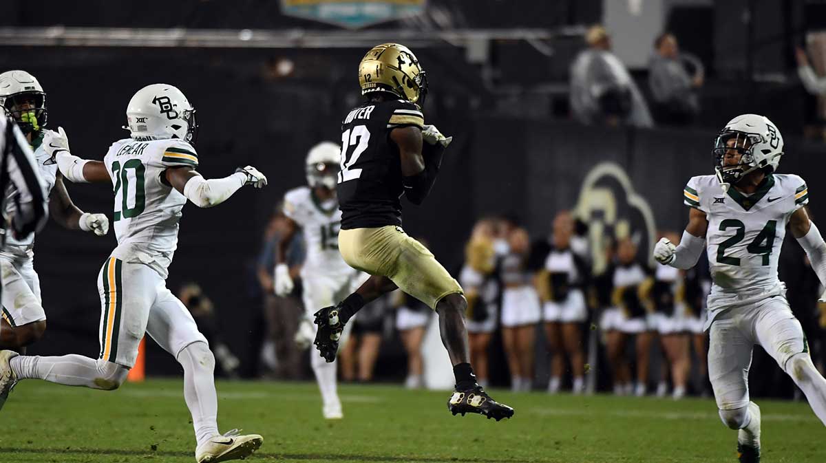 Colorado Buffaloes wide receiver Travis Hunter (12) catches a pass during the second half against the Baylor Bears at Folsom Field.