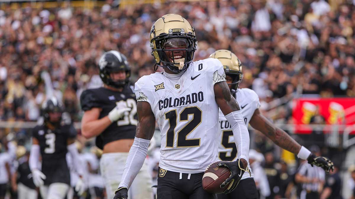 Colorado Buffaloes wide receiver Travis Hunter (12) scores a touchdown against the UCF Knights during the first quarter at FBC Mortgage Stadium.