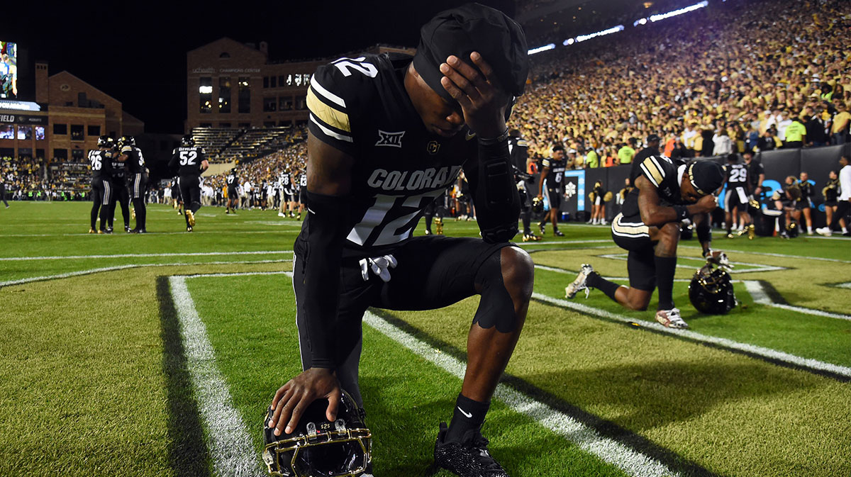 Colorado Buffaloes wide receiver Travis Hunter (12) prays in the end zone before the game against the Kansas State Wildcats at Folsom Field.