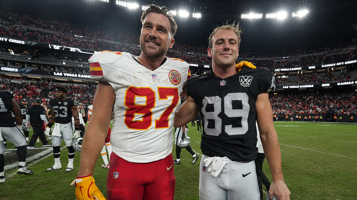 Kansas City Chiefs tight end Travis Kelce (87) and Las Vegas Raiders tight end Brock Bowers (89) pose after the game at Allegiant Stadium.