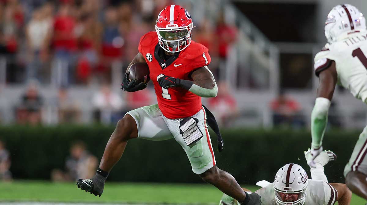Georgia Bulldogs running back Trevor Etienne (1) runs the ball against the Mississippi State Bulldogs in the fourth quarter at Sanford Stadium.