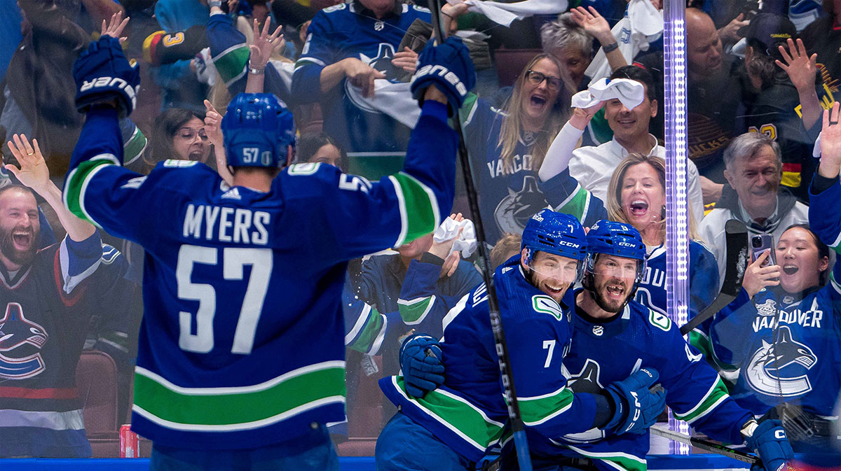 Vancouver Canucks defenseman Tyler Myers (57) and defenseman Carson Soucy (7) and forward J.T. Miller (9) celebrate Miller’s game winning goal against the Edmonton Oilers during the third period in game five of the second round of the 2024 Stanley Cup Playoffs at Rogers Arena.