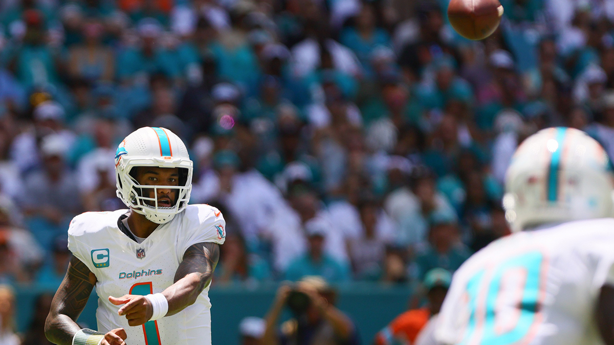 Sep 8, 2024; Miami Gardens, Florida, USA; Miami Dolphins quarterback Tua Tagovailoa (1) passes the football to wide receiver Tyreek Hill (10) against the Jacksonville Jaguars during the first quarter at Hard Rock Stadium.