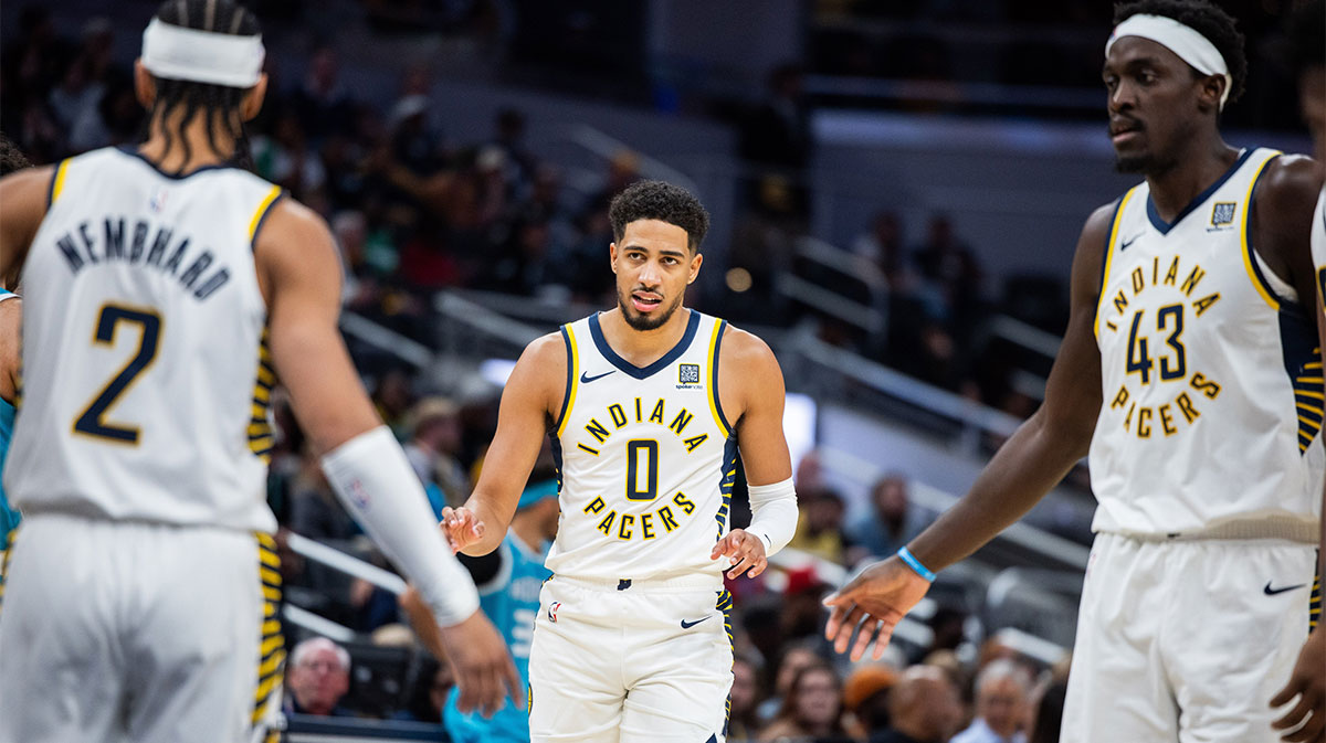 Indiana Pacers guard Tyrese Haliburton (0) talks to teammates in the first half against the Charlotte Hornets at Gainbridge Fieldhouse