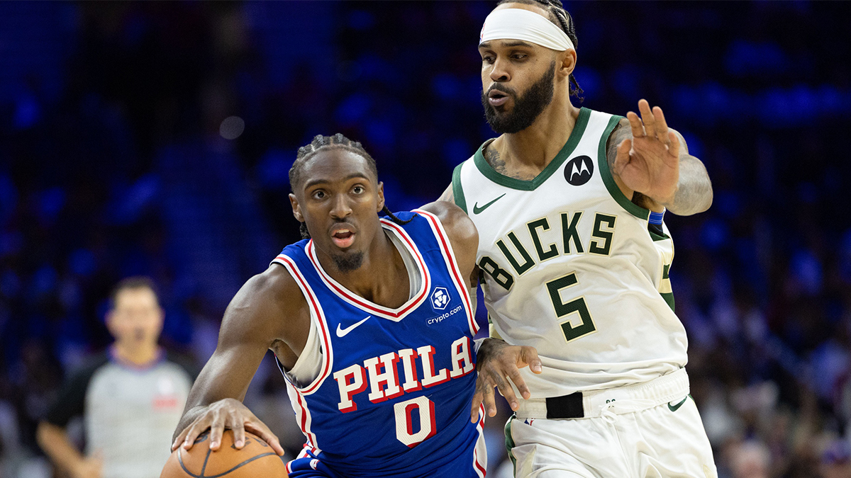 Philadelphia 76ers guard Tyrese Maxey (0) drives past Milwaukee Bucks guard Gary Trent Jr. (5) during the fourth quarter at Wells Fargo Center.