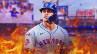 Mets center fielder Tyrone Taylor with flames around him