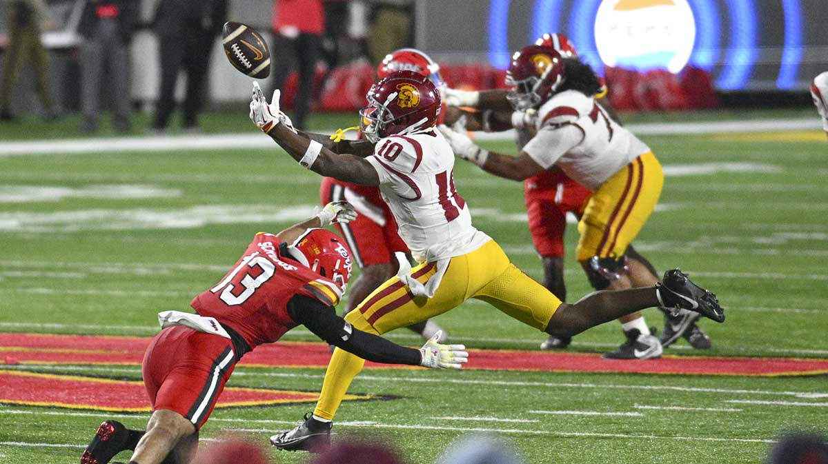 Oct 19, 2024; College Park, Maryland, USA; USC football wide receiver Kyron Hudson (10) can not secure the catch as Maryland football defensive back Glendon Miller (13) defends during the second half at SECU Stadium.