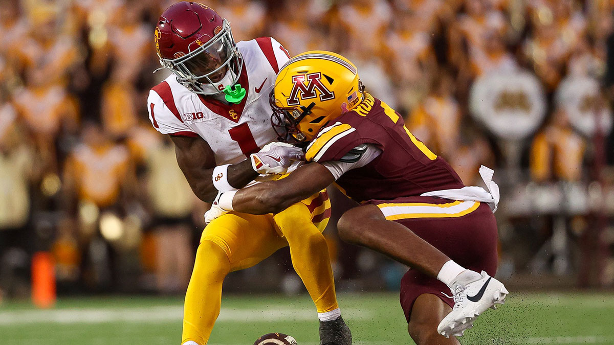 Oct 5, 2024; Minneapolis, Minnesota, USA; Minnesota Golden Gophers defensive back Ethan Robinson (2) breaks up a pass intended for USC Trojans wide receiver Zachariah Branch (1) during the first half at Huntington Bank Stadium. Mandatory Credit: Matt Krohn-Imagn Images