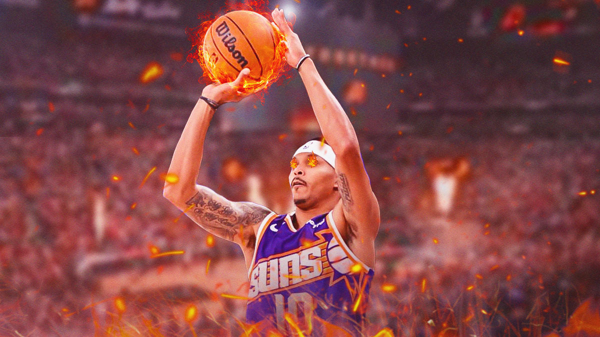 Phoenix Suns shooting guard Damion Lee shooting a ball of fire with fire emojis in his eyes, with a background of the inside of Footprint Center.