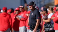 Utah Utes head coach Kyle Whittingham watches his team play against the Utah State Aggies at Merlin Olsen Field at Maverik Stadium