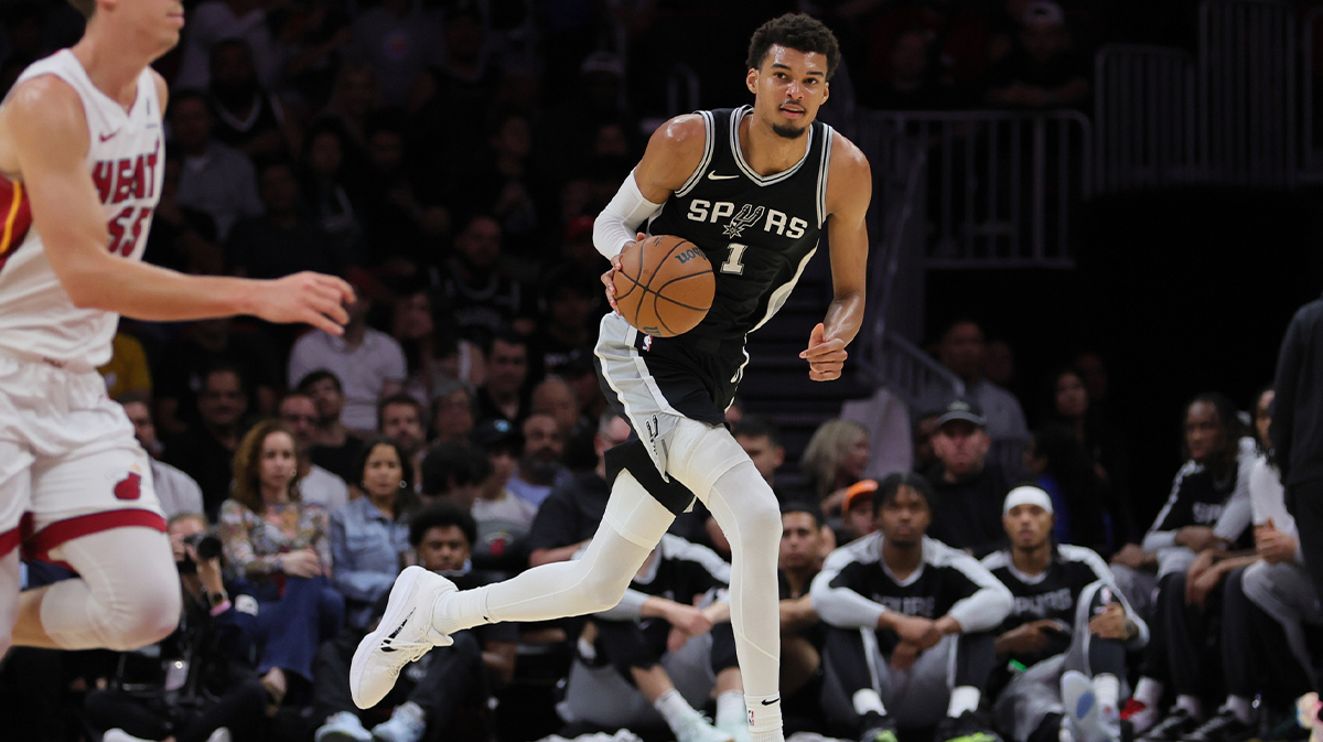 San Antonio Spurs center Victor Wembanyama (1) dribbles the basketball against the Miami Heat during the second quarter at Kaseya Center.