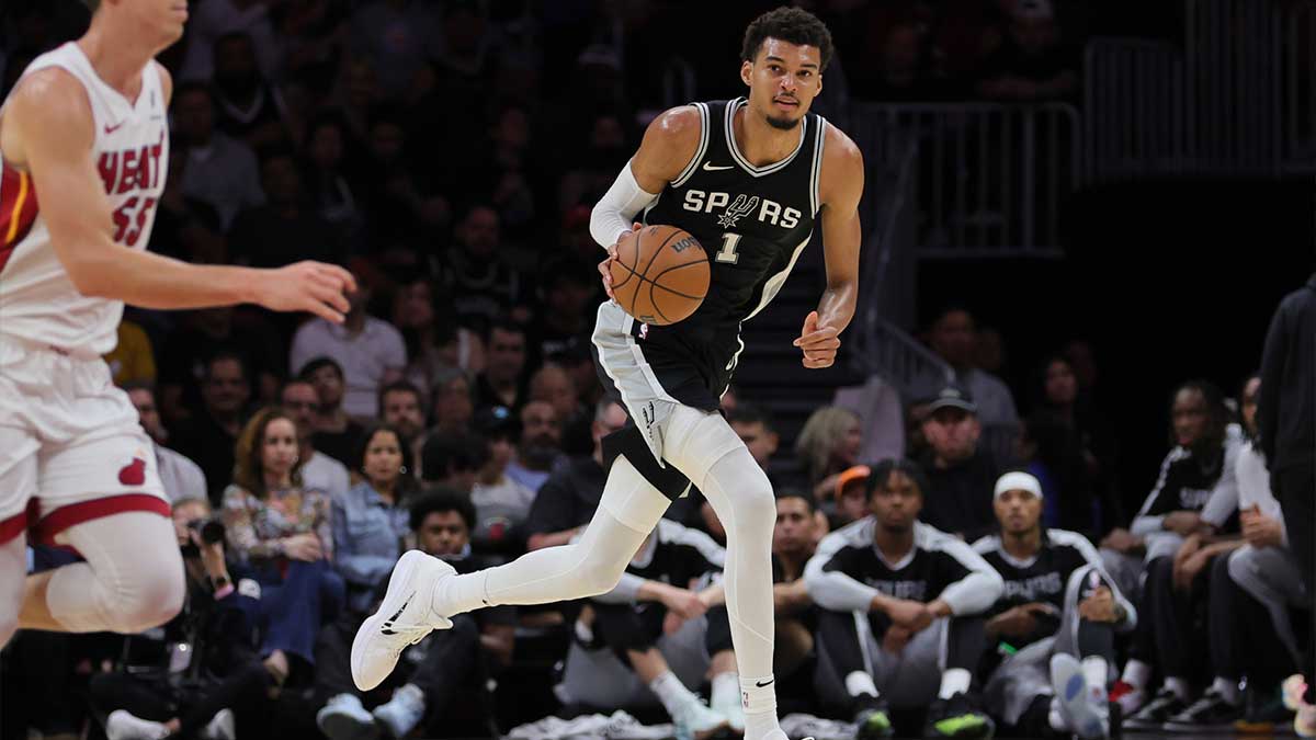 San Antonio Spurs center Victor Wembanyama (1) dribbles the basketball against the Miami Heat during the second quarter at Kaseya Center.