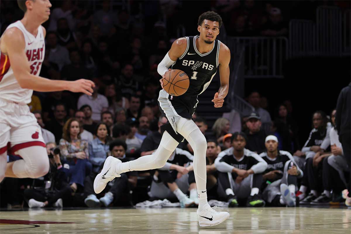 San Antonio Spurs center Victor Wembanyama (1) dribbles the basketball against the Miami Heat during the second quarter at Kaseya Center.