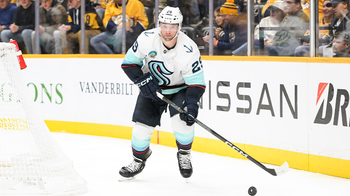 Seattle Kraken defenseman Vince Dunn (29) clears the puck from his zone against the Nashville Predators during the third period at Bridgestone Arena.