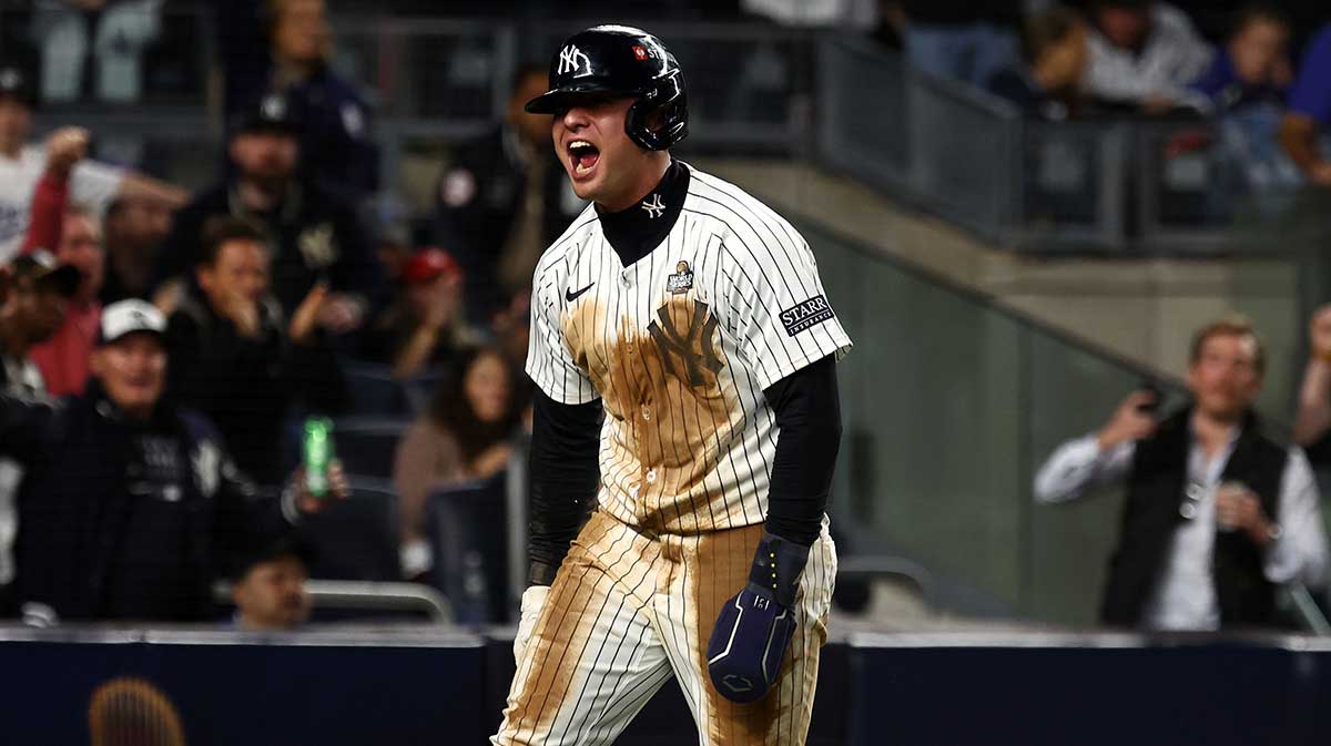 New York Yankees shortstop Anthony Volpe (11) reacts after scoring a run against the Los Angeles Dodgers in the eighth inning during game four of the 2024 MLB World Series at Yankee Stadium.