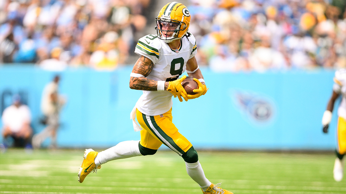 Green Bay Packers wide receiver Christian Watson (9) runs the ball after a made catch against the Tennessee Titans during the first half at Nissan Stadium.