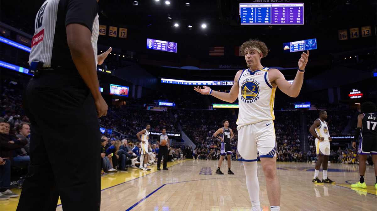 Warriors' Brandin Podziemski questions a referee during a preseason game against the Kings