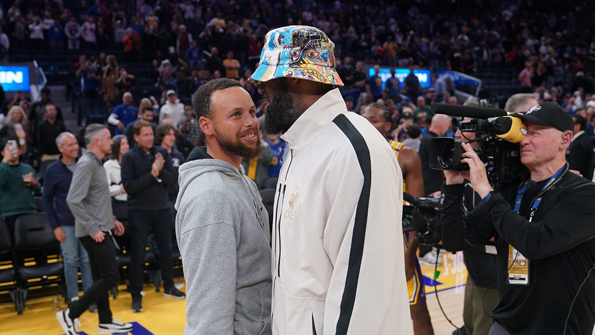 Warriors guard Stephen Curry (30) meets with Los Angeles Lakers forward LeBron James (23) after the game at the Chase Center