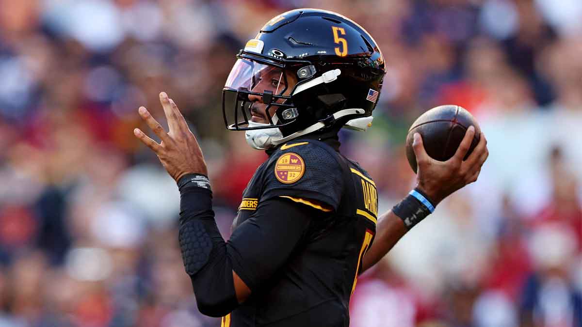 Washington Commanders quarterback Jayden Daniels (5) throws a pass during the first quarter against the Chicago Bears at Commanders Field.