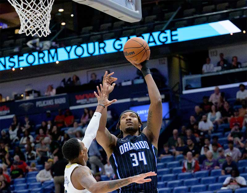  Orlando Magic center Wendell Carter Jr. (34) shoots against New Orleans Pelicans guard Dejounte Murray (5) during the first half at Smoothie King Center.