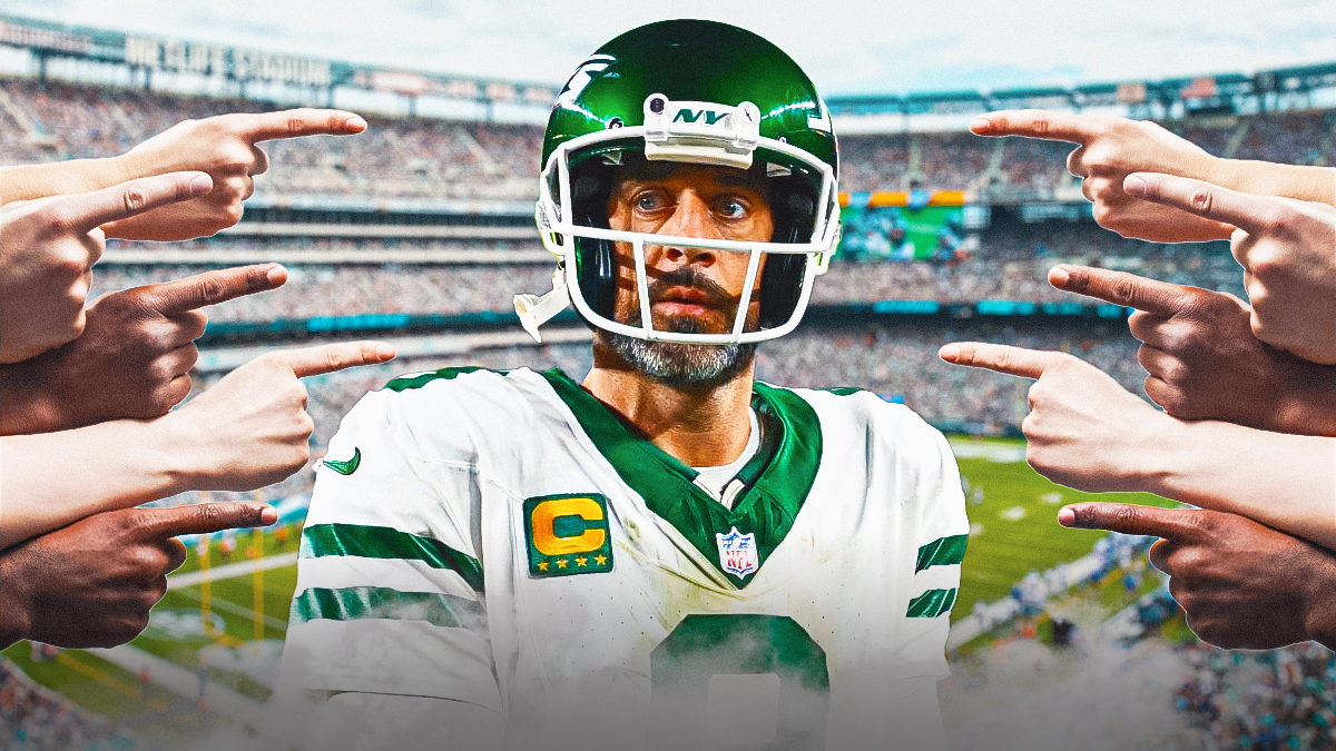 New York Jets' Aaron Rodgers with fingers pointing at him.