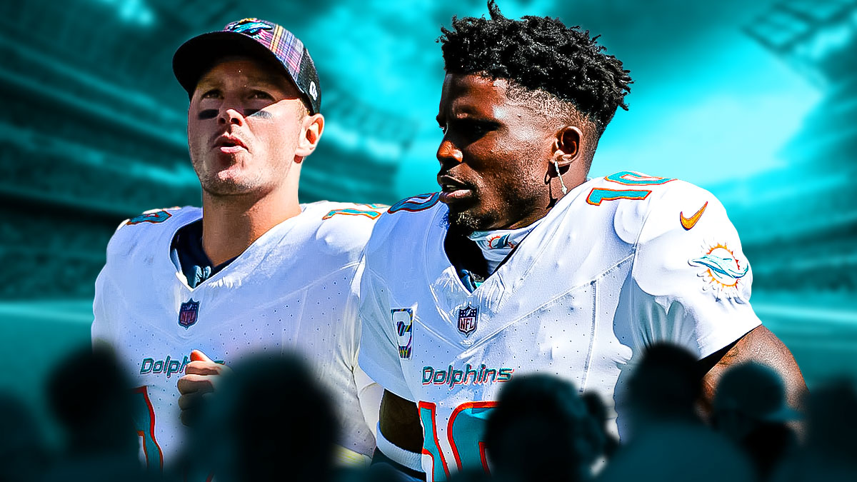 Tim Boyle beside Tyreek Hill wearing Dolphins gear.