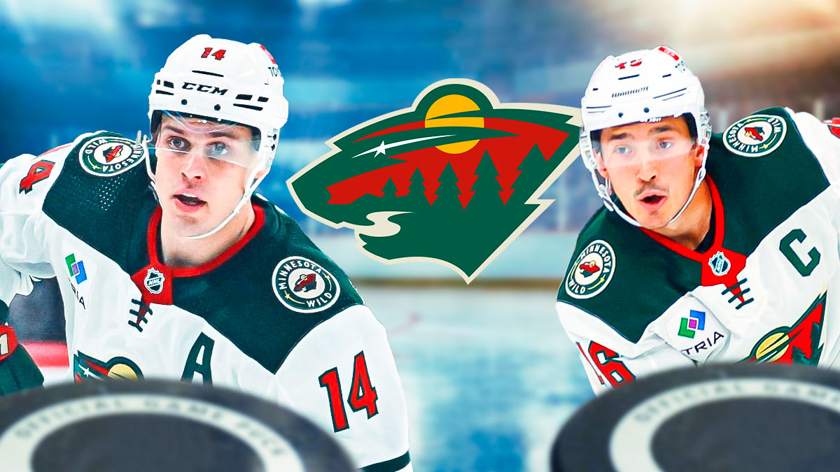 Joel Eriksson Ek and Jared Spurgeon looking hopeful, Minnesota Wild logo in middle, hockey rink in background