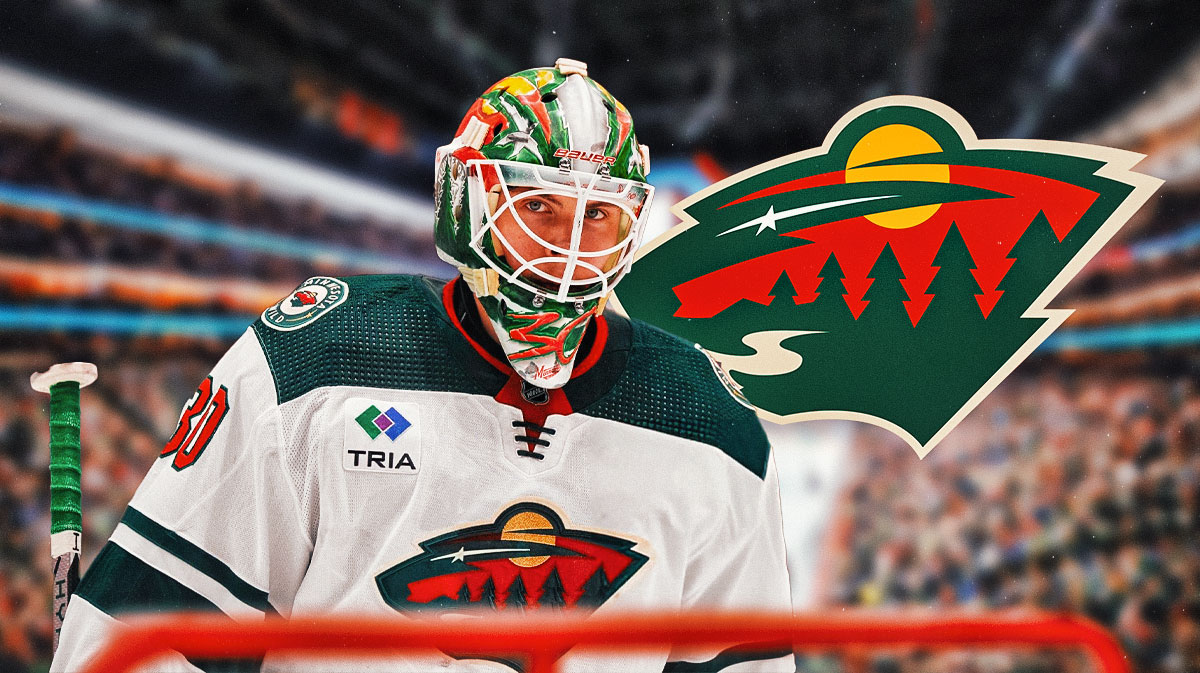 Jesper Wallstedt looking happy, Minnesota Wild logo, hockey rink in background