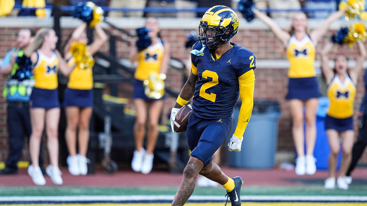 Michigan defensive back Will Johnson (2) celebrates a touchdown after intercepting USC quarterback Miller Moss (7) during the second half at Michigan Stadium in Ann Arbor on Saturday, Sept. 21, 2024.