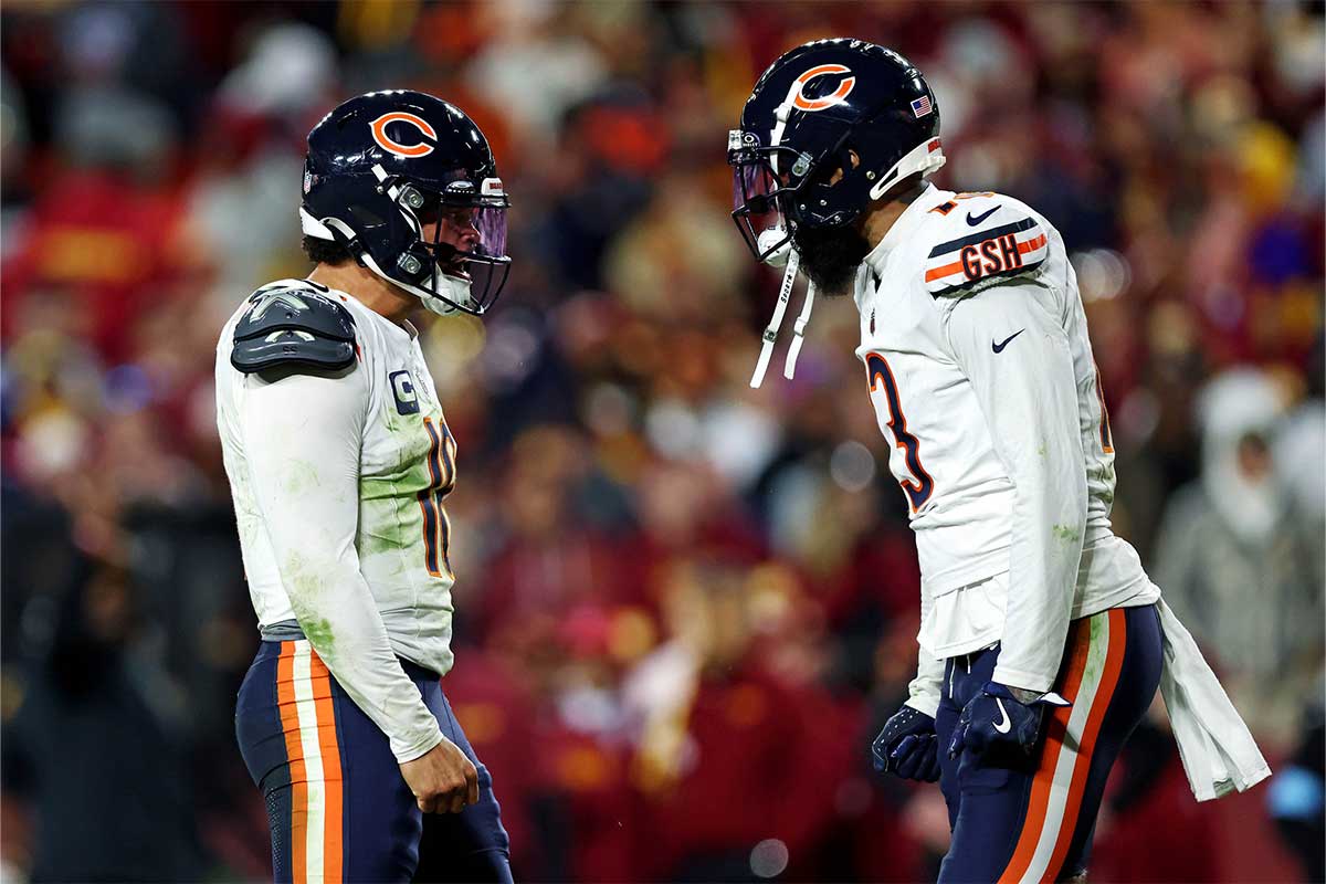 Chicago Bears quarterback Caleb Williams (18) celebrates with wide receiver Keenan Allen (13) after the Bears scored a touchdown during the fourth quarter against the Washington Commanders at Commanders Field.