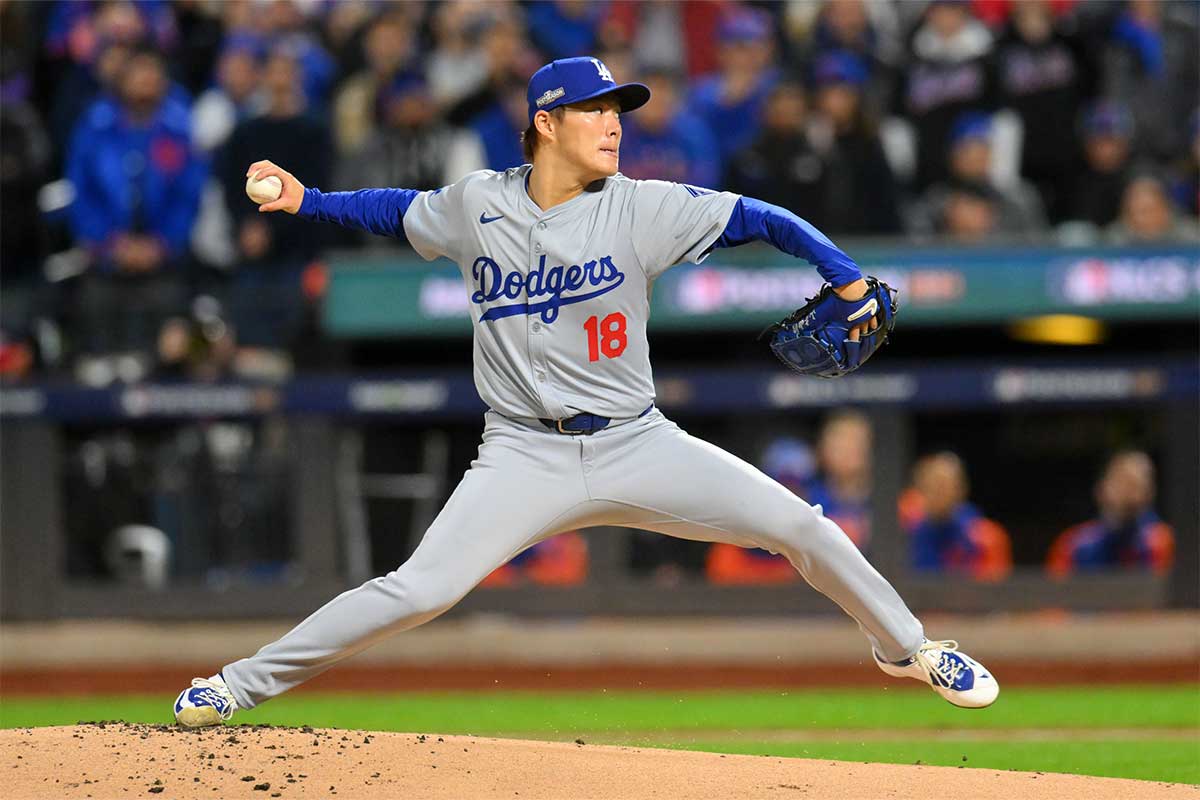 Los Angeles Dodgers pitcher Yoshinobu Yamamoto (18) throws a pitch against the New York Mets in the first inning during game four of the NLCS for the 2024 MLB playoffs at Citi Field.