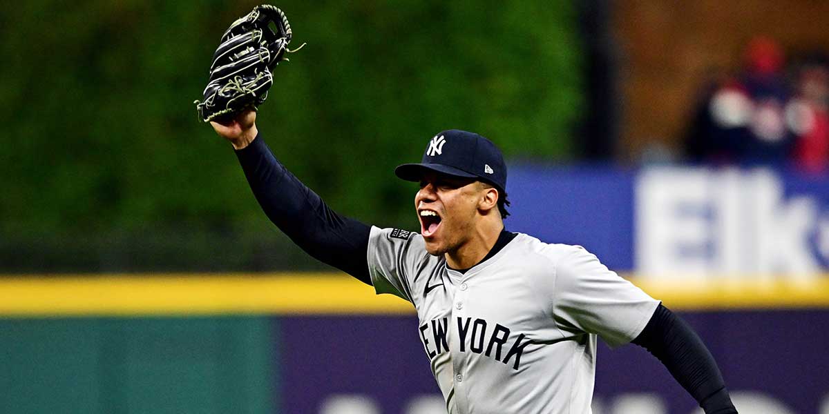 New York Yankees outfielder Juan Soto (22) celebrates after making the final out to beat the Cleveland Guardians during game five of the ALCS for the 2024 MLB playoffs at Progressive Field
