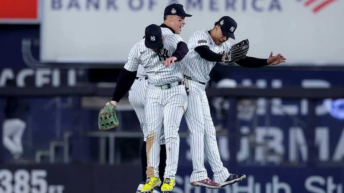 New York Yankees outfielder Alex Verdugo (24), outfielder Aaron Judge (99) and outfielder Juan Soto (22) celebrate after winning game four of the 2024 MLB World Series against the Los Angeles Dodgers at Yankee Stadium.