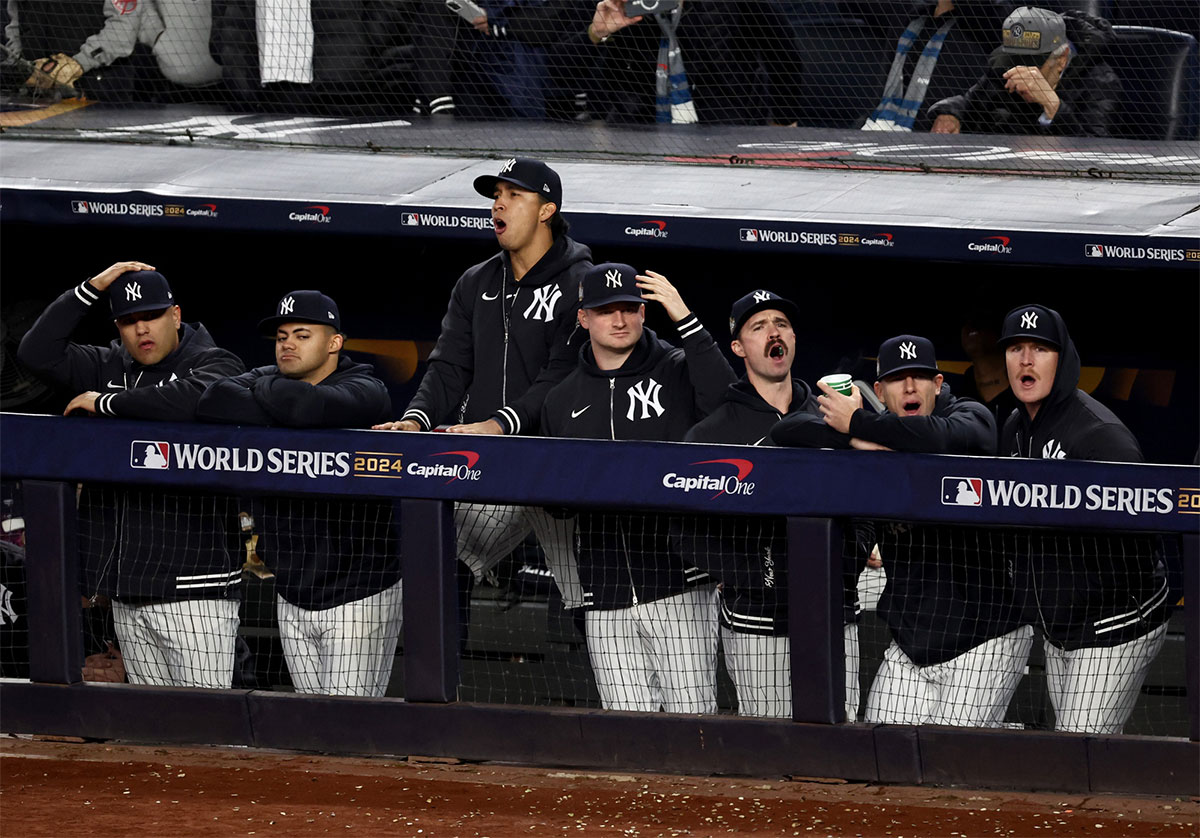 New York Yankees bench reacts to a called strike three during the seventh inning against the Los Angeles Dodgers in game three of the 2024 MLB World Series at Yankee Stadium.