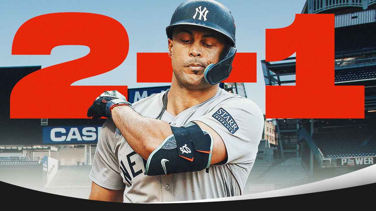 Nathan Yasis, Associate Editor Giancarlo Stanton looking disappointed wearing Yankees gear. huge "2-1" in the background.