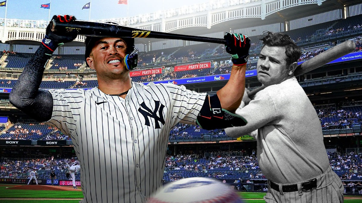 Yankees' Giancarlo Stanton with large biceps , with Babe Ruth beside him