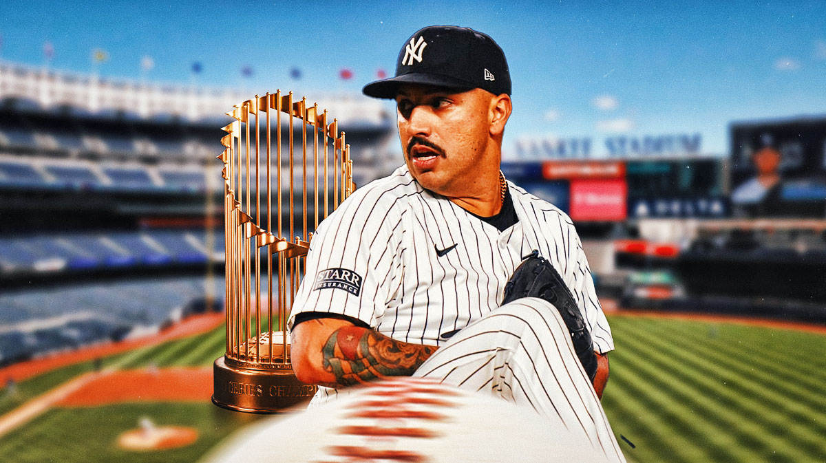 Nestor Cortes (Yankees) pitching at Yankee Stadium with the World Series trophy visible